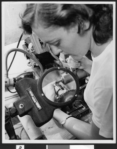 Close-up of a woman working at the Lear Corporation, September 1950