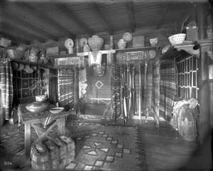 Interior view of the den in George Wharton James residence, showing a tremendous number of Native American artifacts, Pasadena, ca.1908