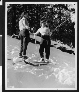 Two female skiers in the snow, in December 1941