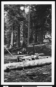 Men in a campsite at Lily Spring Camp on the north side of Mount Hawkins, ca.1930