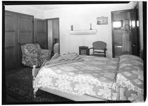 Interior of a bedroom at the San Gabriel Auto Court on Valley Boulevard, August 1934