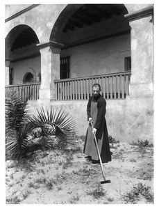 Franciscan monk working in the garden at Mission Santa Barbara, ca.1904