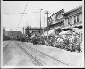 Los Angeles Bicycle club gathering for a race on the west side of Spring Street between Eighth and Ninth Streets, October 1904