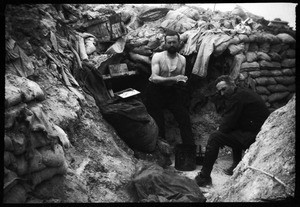 Two soldiers washing up in a trench during World War I, ca.1916