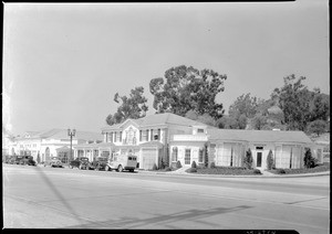 Exterior view of a row of shops along Sunset Boulevard, ca.1930-1939