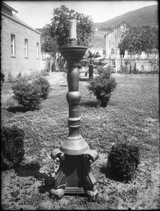 Paschal candlestick in yard of Mission San Diego de Alcala, California, ca.1900