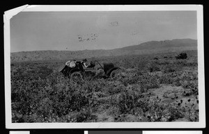 View of an early automobile in the desert near Mecca, ca.1920