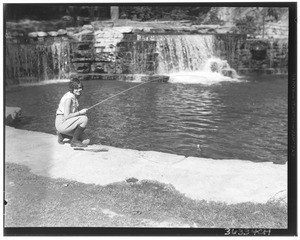 Jewell Teegardin with a rainbow trout at Rainbow Angling Club, Azusa, October 1930