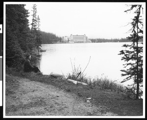 Woman sitting near a lake, Canada, ca.1930-1939