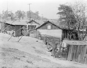 A dilapidated adobe on the west side at the north end of the Broadway Tunnel, Los Angeles, 1920