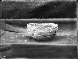 Indian basket on display, ca.1900