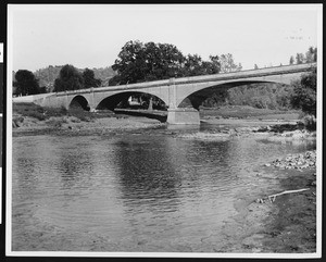 View of the new bridge across the Stanislaus River for the mother lode highway at the site of the old Robinson's Ferry crossing of 1849, Melones, ca.1930