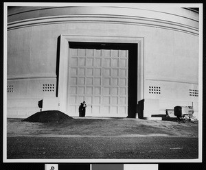 Exterior view of Mount Palomar Observatory showing a large door, ca.1930-1940