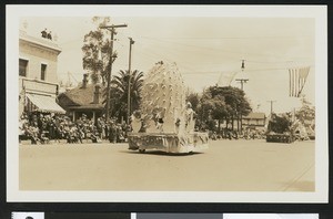 Parade with a cactus-shaped float, ca.1920