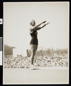 National diving champion Georgia Coleman on a diving board at the Los Angeles Athletic Club, ca.1930