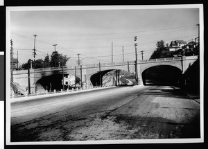 Concrete viaduct crossing a street and railroad tracks