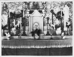 Altar at Camulos Ranch, California, showing torn cloth that was mended by Ramona, 1901