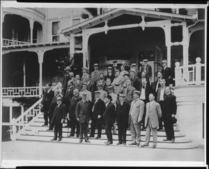 Members of the Sunset Club posing for a portrait on the steps of the Hotel Raymond in Pasadena, ca.1910