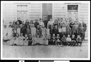 A group portrait of students and their teachers of La Dow School, 1896