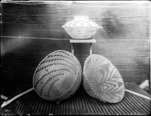 Three Indian baskets on display, ca.1900