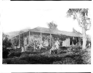 Portrait of Charels and Nellie Bogue in front of the former home of Tomas Sanchez in Glendale, 1895