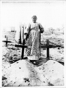 Ramona standing at the grave of Alesandro in the cemetery on the Coahuilla Indian Reservation, ca.1905