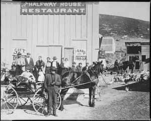 People posing in front of the Halfway House Restaurant in San Pedro