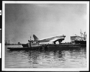 Douglas DC-2 plane at Los Angeles Harbor ready for shipment to Australia, 1937