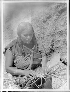 Hopi Indian woman basket maker, ca.1900