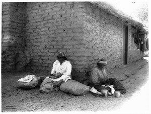 Sensioni Cibinoat, wife of Semon, and her sister, Soledad Chatincat, making baskets, ca.1900