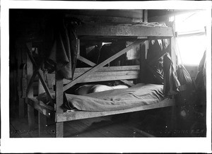 Interior of an American Expeditionary Force barracks showing a double-decked bunk, ca.1915