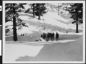 Group of people heading up the slopes at Big Pines mountain camp, ca.1930