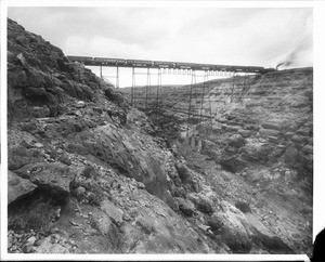 View of a train crossing a bridge over Canyon Diablo on a Navajo reservation in Arizona, ca.1900