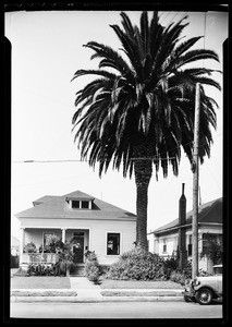 Exterior view of small houses in an unidentified residential neighborhood