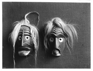 Two Alaska Iroquois Indian masks on display, ca.1900