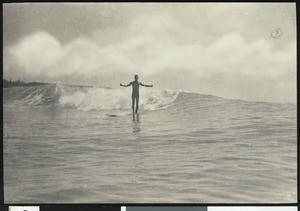 Male surfer riding the waves at Waikiki Beach, Honolulu, ca.1930