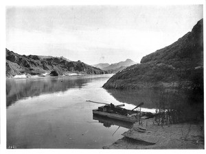 A small ferry boat moored along the Colorado River in one of the Mojave canyons, California, 1900-1950