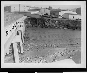 Flood damage to Warner Brothers Studio, showing a bridge, 1938