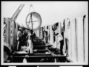 Workers constructing a storm drain