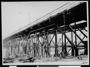 View of railroad ties near the base of a wooden viaduct in Los Angeles