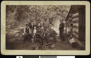 A group portrait of fishing club members outside a mountain residence, ca.1910-1920