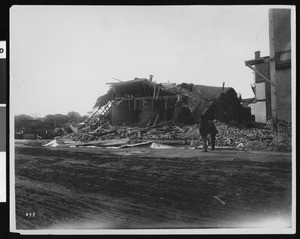 View of San Jose following the 1906 earthquake, showing damage done to a wooden building in which six were killed, 1906