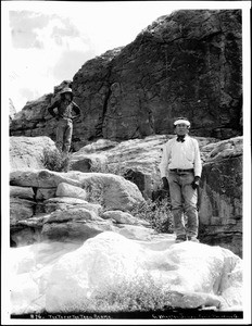 Two Acoma Indian men stand at the top of the Acoma Trail, 1886