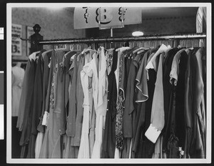 Rack of women's clothing in a store, ca.1930