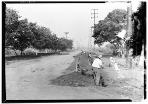 Workmen laying a gas pipe in the University District, September 1928