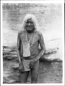 Hopi Priest with bag of sacred meal for the Flute Dance Ceremony at the pueblo of Walpi, Arizona, ca.1898