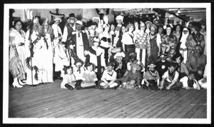 A group of people in costume on a deck