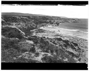 View of Balboa Beach at Corona Del Mar, showing the cliffs, 1924