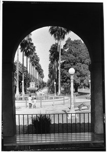 South Park scenic, palm lined walk through arch, July 25, 1930