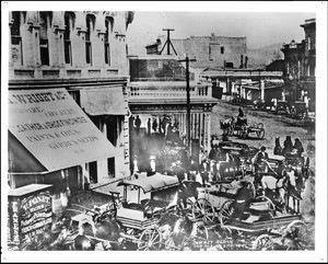 Traffic at the northwest corner of Downey Block at Main Street looking north from Temple Block, ca.1873-1878